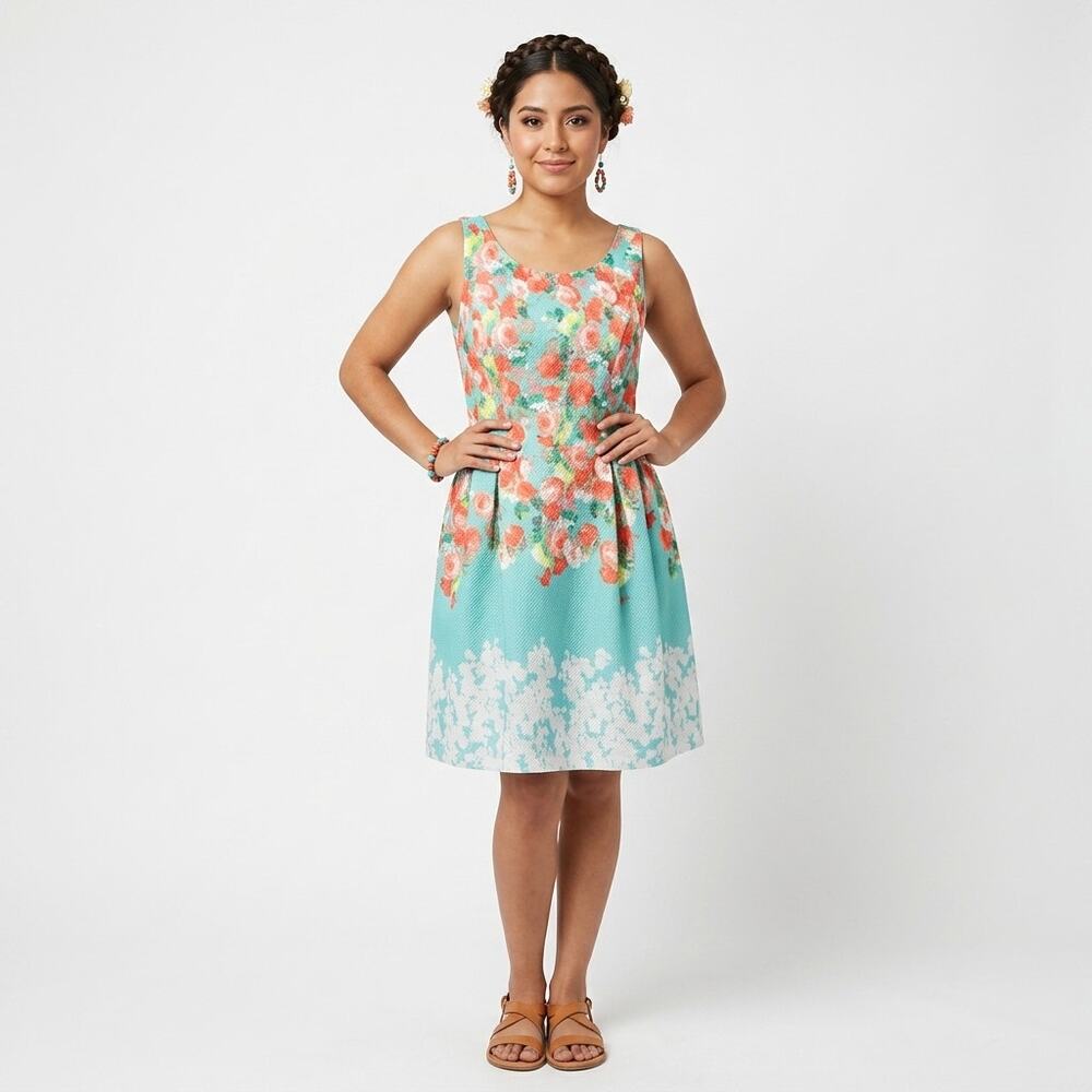 This is a turquoise floral party dress by Donna Ricco Size 16